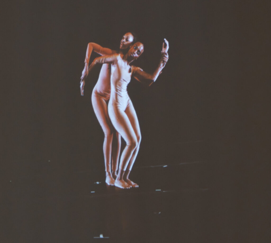 Two Garth Fagan dancers stand in a pose, which was videoed and on display at the Memorial Art Gallery.