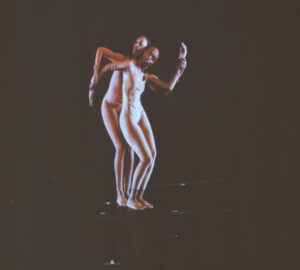 Two Garth Fagan dancers stand in a pose, which was videoed and on display at the Memorial Art Gallery.