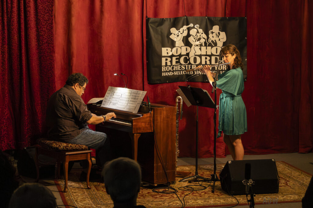 Arturo O'Farrill plays an upright piano facing flutist Elsa Nilsson.